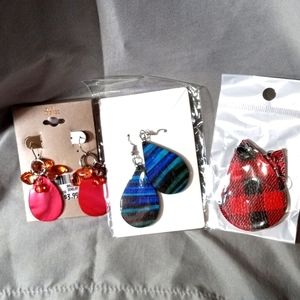 Three pairs of earrings silver toned